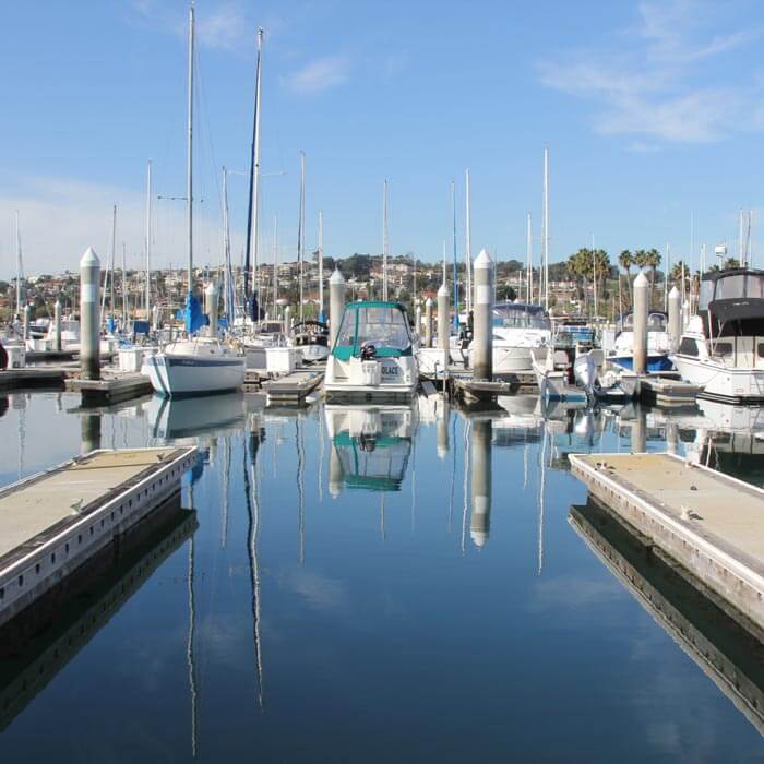 Marina view with yachts and boats peacefully docked in sunny South California at the California Yacht Marina