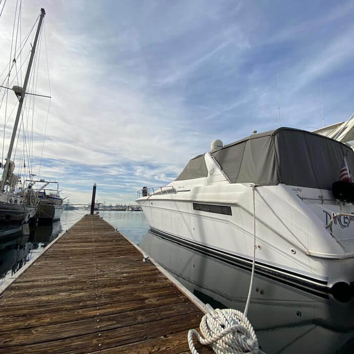 boat tied to dock in the marina