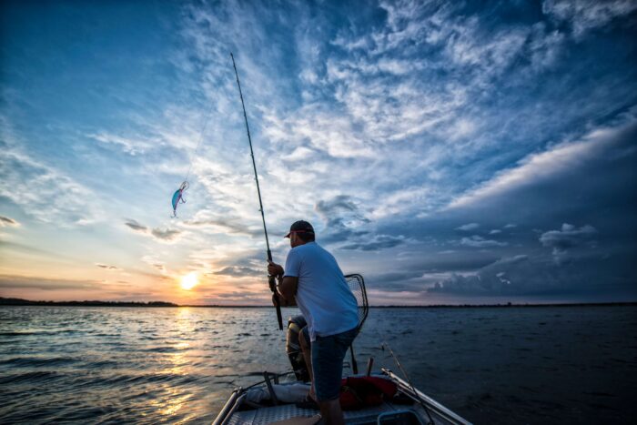 The man fishing in ocean using fishing hook at San Pedro, CA